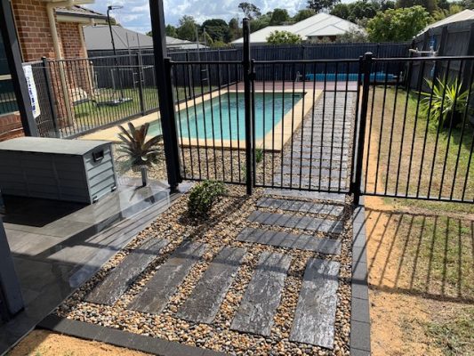 North Brisbane landscaping - photo after swimming pool area landscaping and decking completed