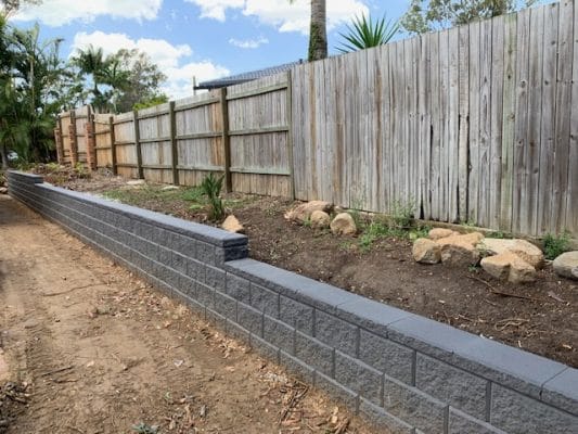 Charcoal Heron block retaining wall in a Brisbane landscaping Project by Instant Greenscene